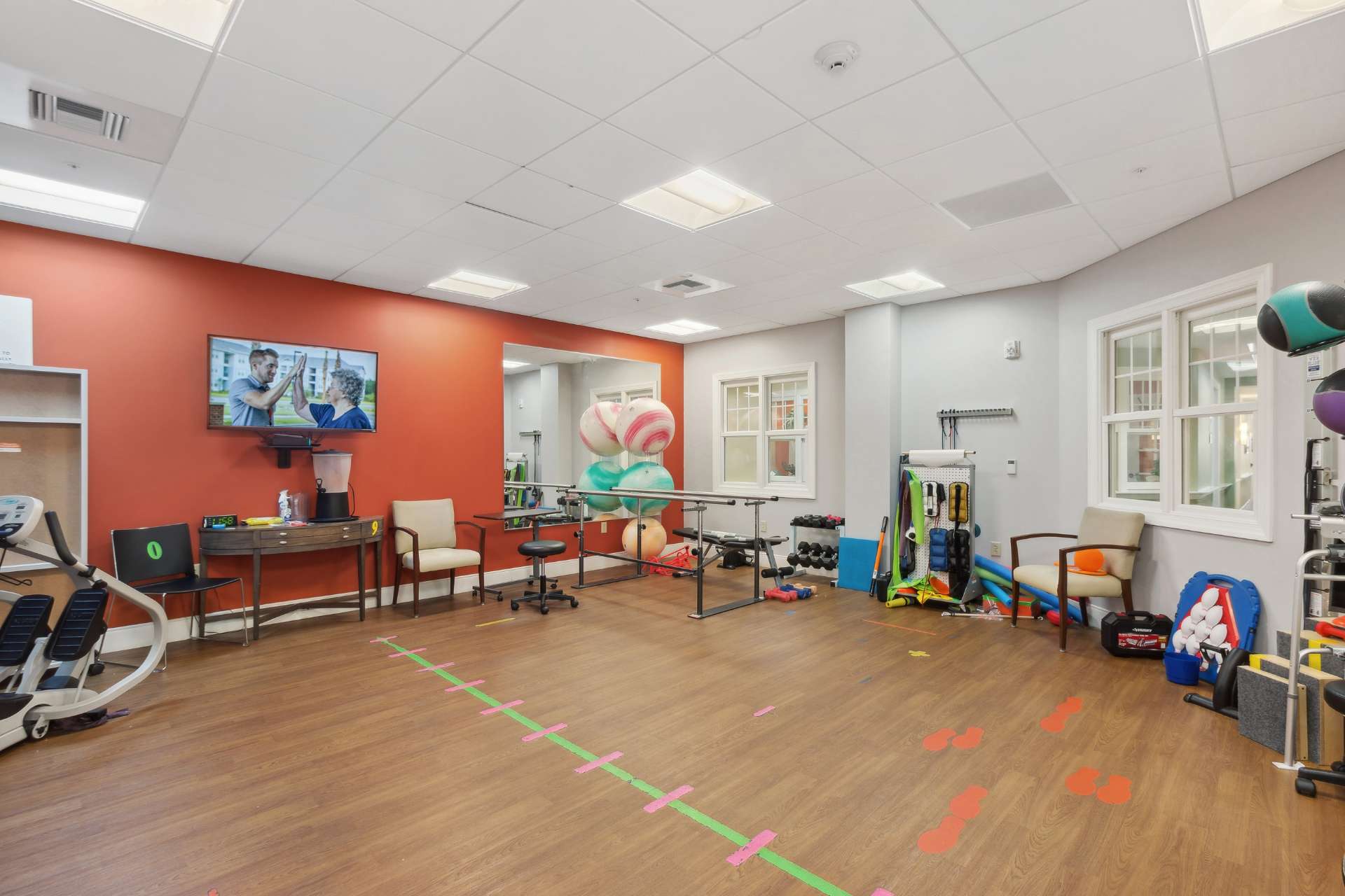 A gym with various workout equipment and tools.