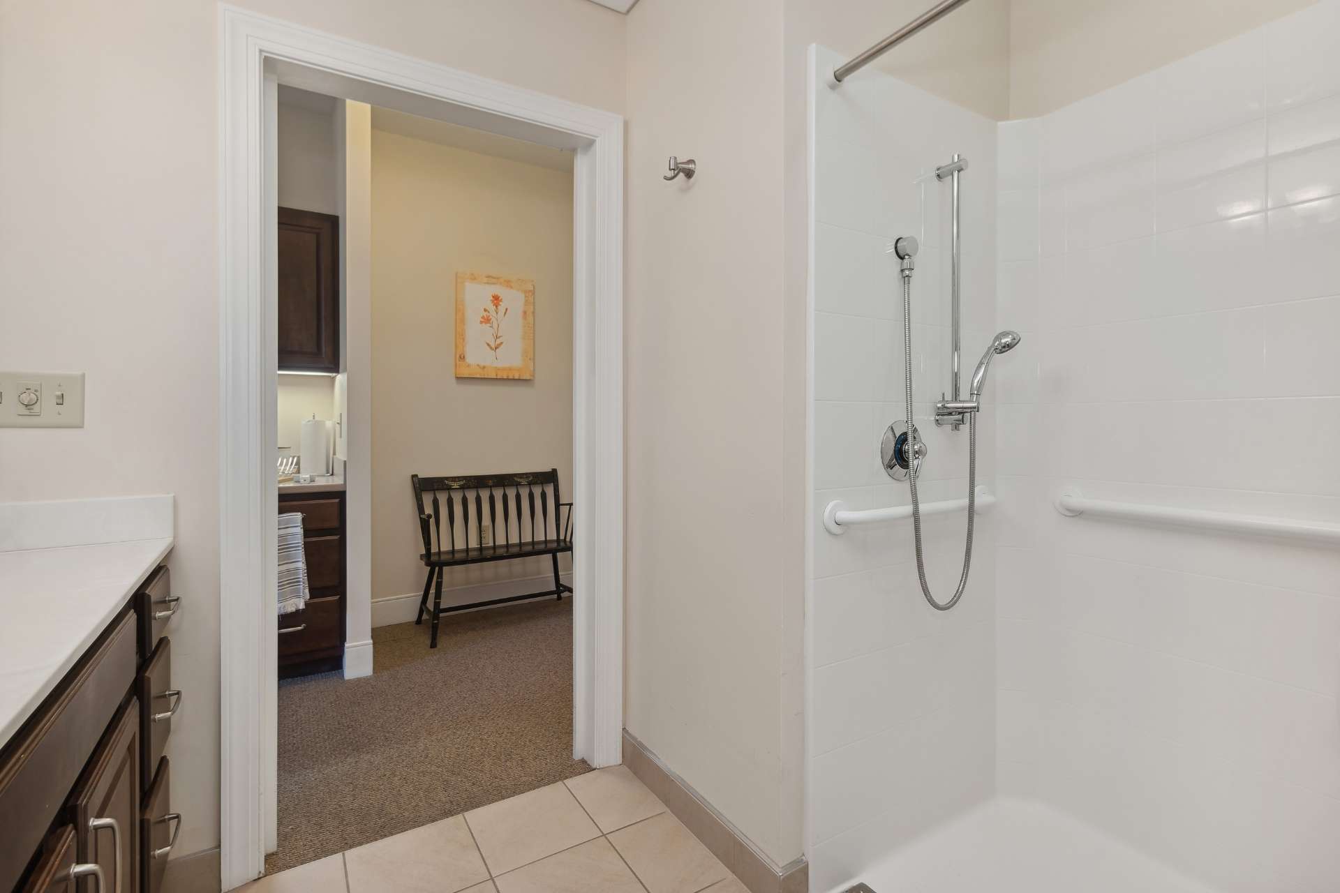A view of a private bathroom shower.
