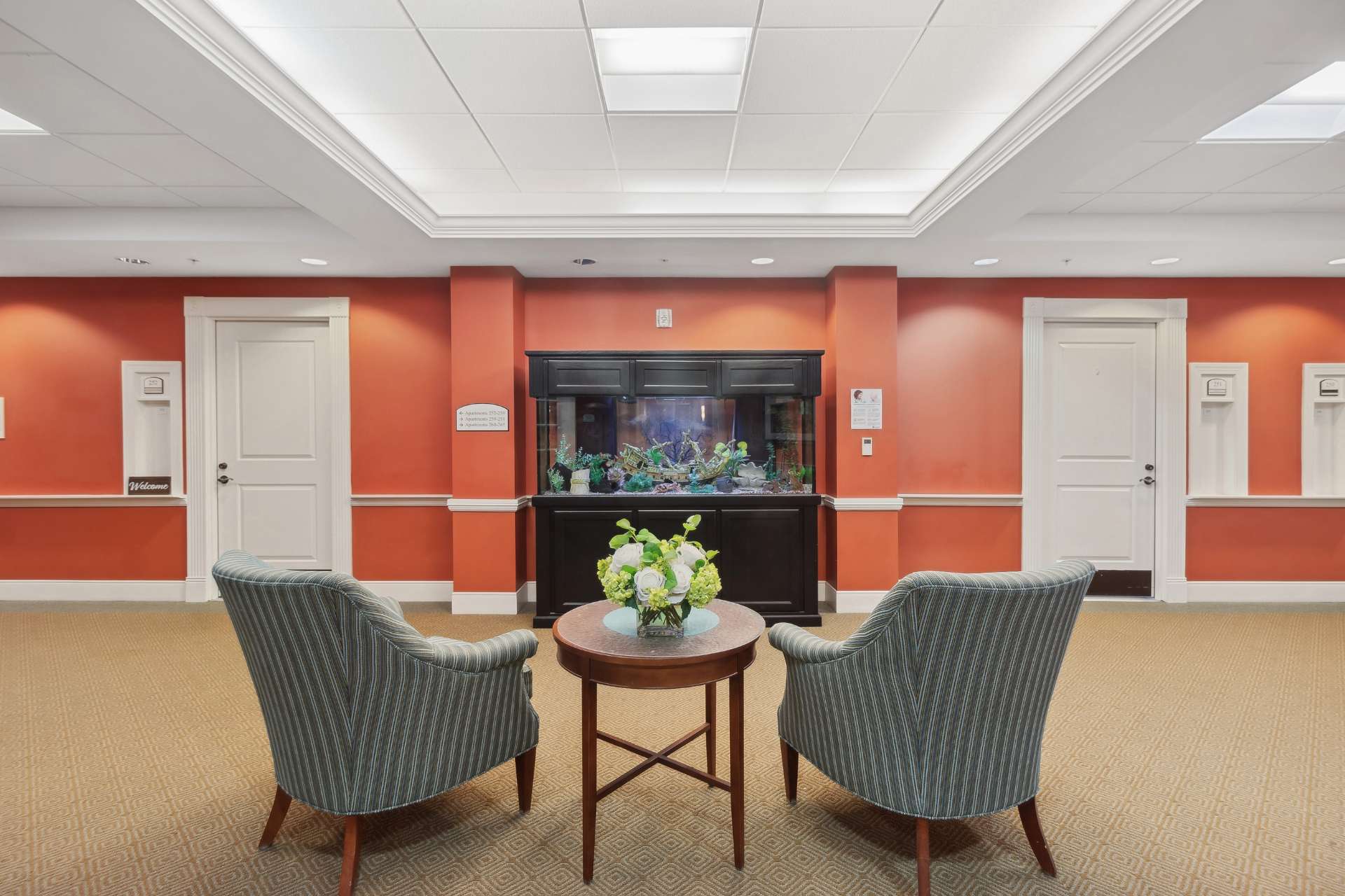 A seating area with a view of the aquarium.