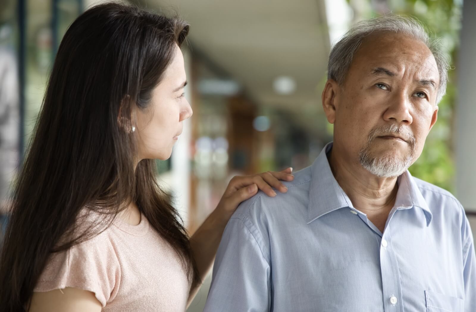 An adult child is taking care of their senior parent, who wandered off and is experiencing dementia-related memory loss.